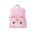 Skip Hop Besties Squad unicorn backpack for kids in pastel pink, front view showing unicorn face front pocket with golden horn, rainbow mane and pink ears